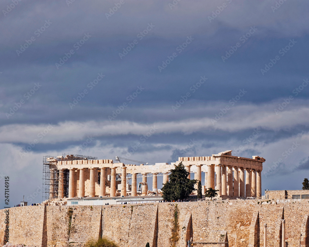 Parthenon ancient temple under impressive cloudy sky, Athens Greece