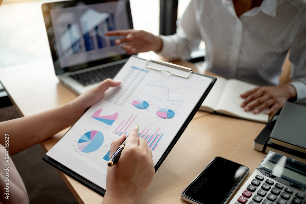 business executives negotiate meeting in modern office discussing a quality data. business executives negotiate meeting in modern office discussing a quality data.