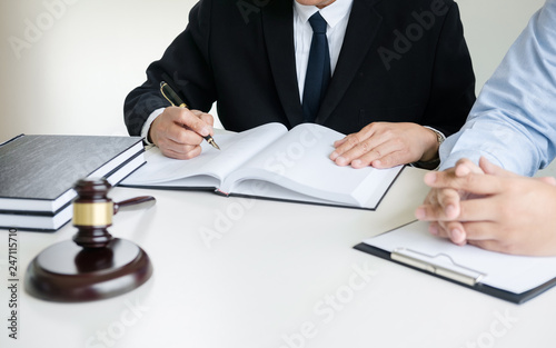 lawyer consultant give an advice with client at law firm.