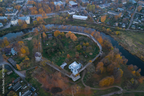A view from a great height on the medieval fortress of the Porkhov in the October evening. Pskov region, Russia