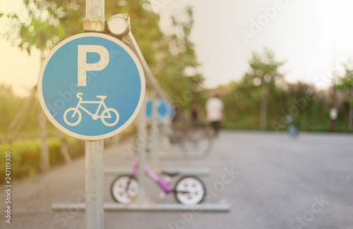 Bicycle sign, plate for bikes park in evening