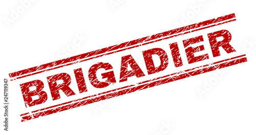 BRIGADIER seal print with corroded effect. Red vector rubber print of BRIGADIER caption with unclean texture. Text caption is placed between double parallel lines.