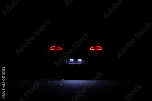 Wallpaper Mural Led tail lights of modern car at night. Lights of licence plate Torontodigital.ca