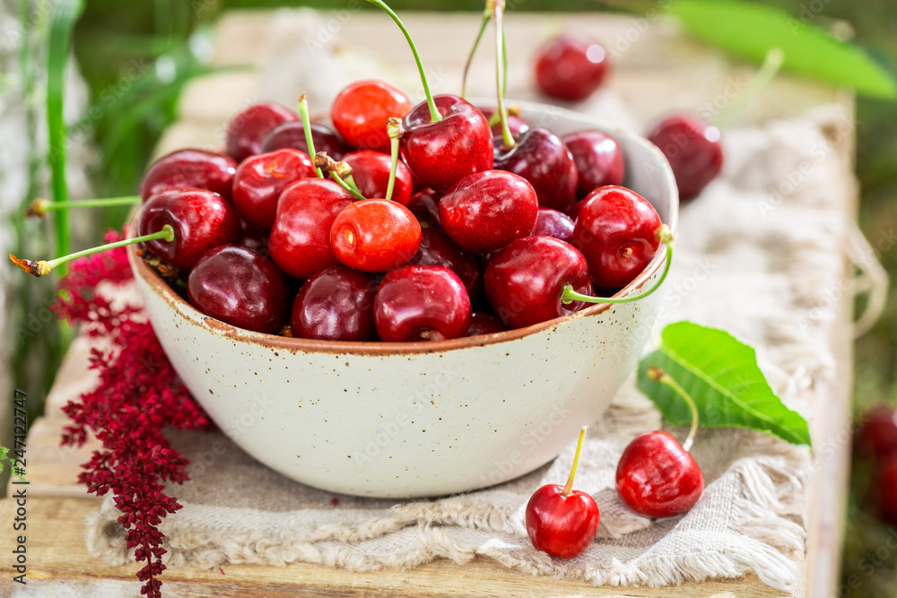 Red sweet cherries in the white bowl Red sweet cherries in the white bowl