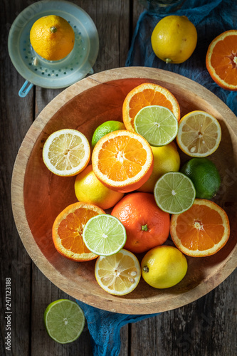 Tasty mix of citrus fruits with on wooden table
