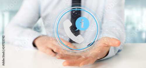 Businessman holding a customer and assistance hotline service button 3d rendering