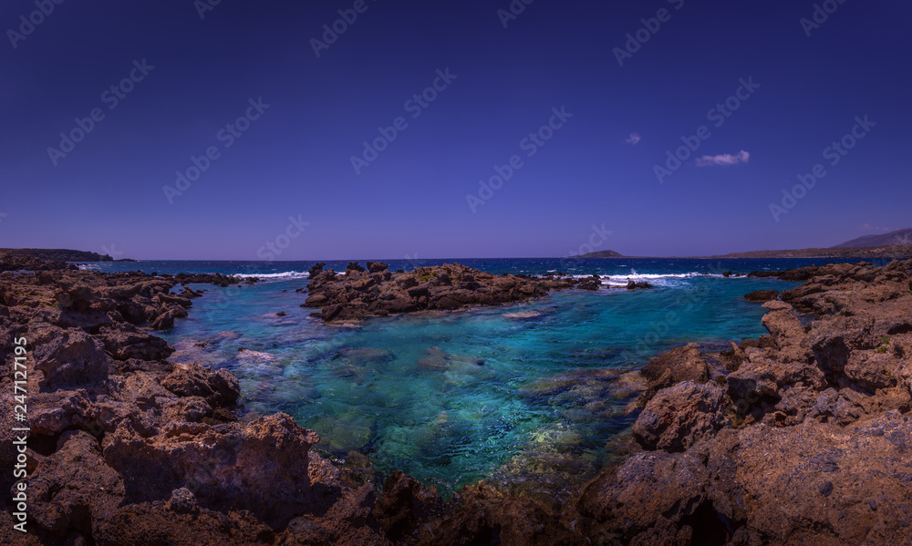 Beautiful coastline of Crete island at sunset