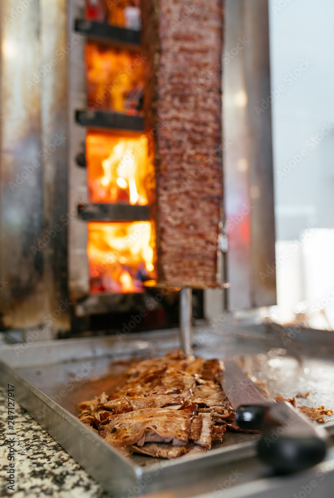 Turkish Doner Kebab, Shawarma or Gyros. Traditional Turkish Doner Kebab meat, shawarma or gyros. Turkish, greek or middle eastern arab style doner kebab food spit.