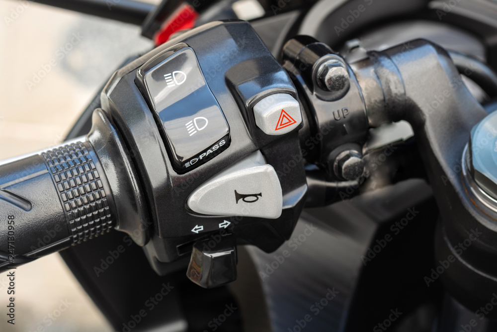 Handlebar with buttons of motorbike, switch control panel motorcycle horns  button,High headlight and pass, turn signal, emergency light Stock Photo |  Adobe Stock