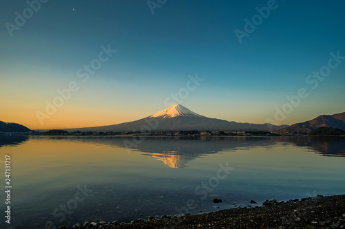 Reflection of Fuji mountain with snow capped in the morning Sunrise at Lake kawaguchiko  Yamanashi  Japan. landmark and popular for tourist attractions