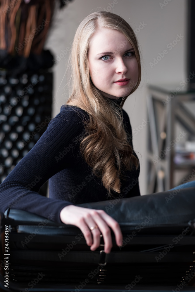 young woman sitting on a chair young woman sitting on a chair