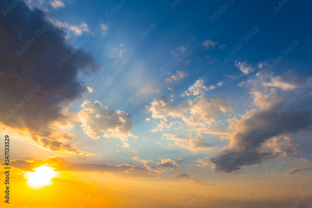 dramatic sunset among a dense clouds, natural background
