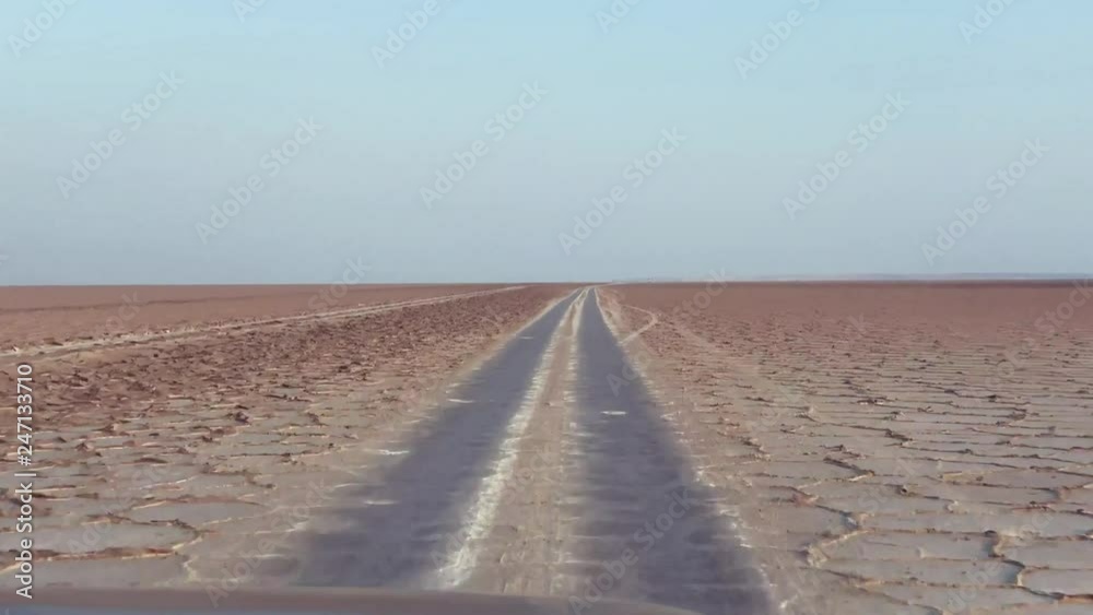 red four wheel drive passing the salt lake on sunrise tc01