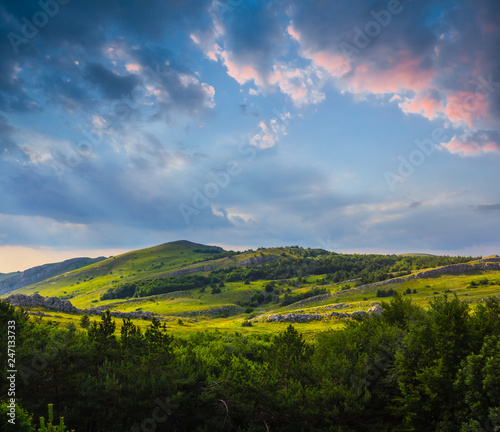 beautiful green mountain valley at the dramatic evening