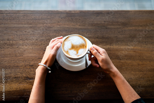 Obraz na plátne Girl having coffee in the bar
