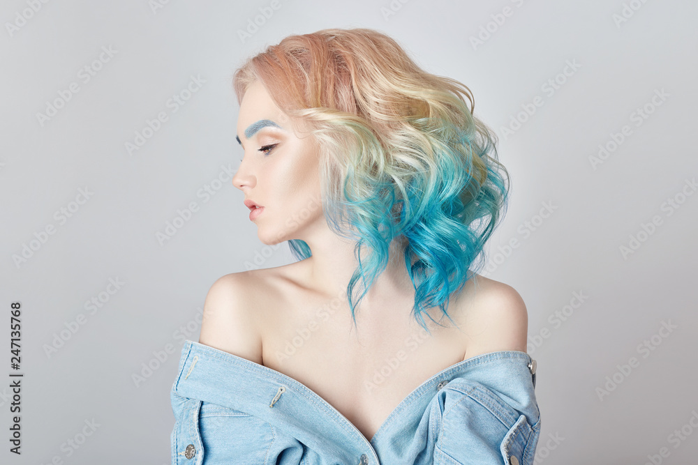 Portrait woman with bright colored flying hair, all shades purple blue. Hair  coloring, beautiful lips and makeup. Hair fluttering in wind. Sexy girl  with short hair. Professional creative coloring Stock Photo |