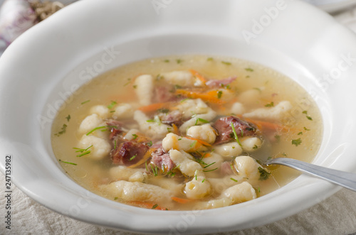 Smoked meat soup with pasta inside