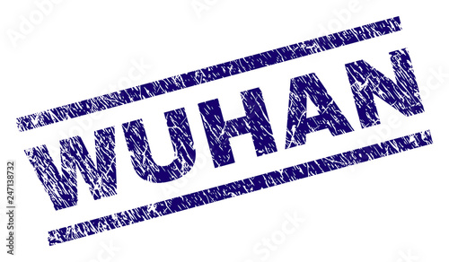 WUHAN seal print with grunge style. Blue vector rubber print of WUHAN label with unclean texture. Text label is placed between parallel lines.