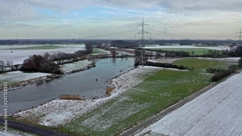 Wallpaper Mural The Schwafheimer sea is a nature conservation area in Moers in a former flood gutter of the river Rhine in Germany - Aerial view with the chimneys of Duisburg city in the background Torontodigital.ca