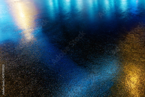 Wet colored asphalt. Road texture. Road background
