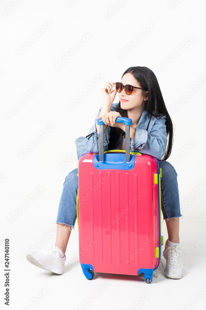 Traveler tourist woman in summer casual clothes.Asian Smiling woman wearing sun glasses.Passenger traveling abroad to travel on white background. Traveler tourist woman in summer casual clothes.Asian Smiling woman wearing sun glasses.Passenger traveling abroad to travel on white background.