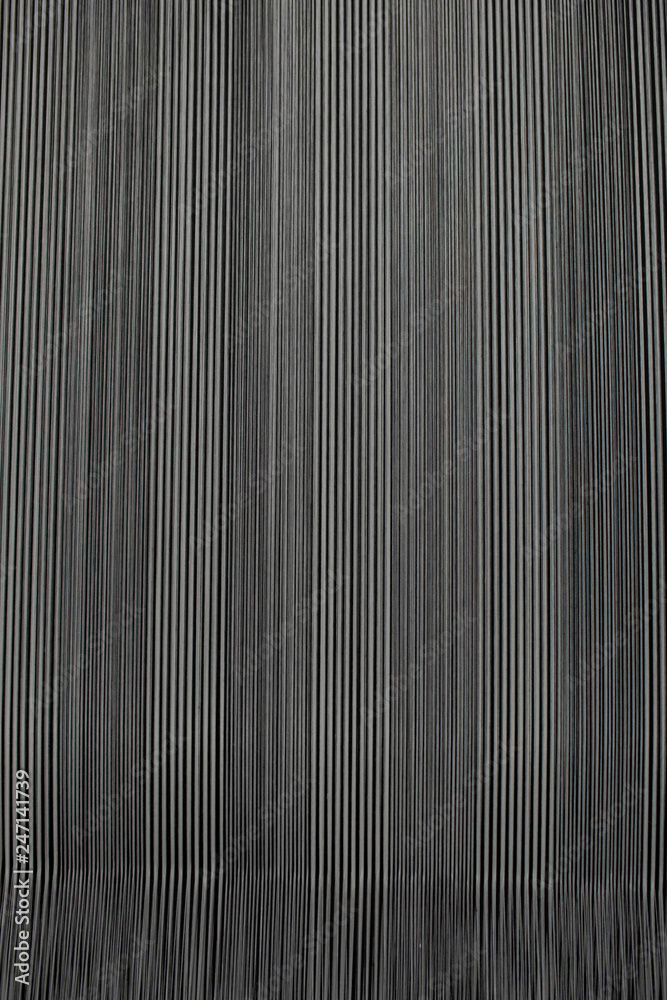 Yarn thread lines on the weaving loom machine. A loom machine for clothing or woven label. Weaving machine for garment industry. Weaving loom in textile factory. Yarn thread lines on the weaving loom machine. A loom machine for clothing or woven label. Weaving machine for garment industry. Weaving loom in textile factory.