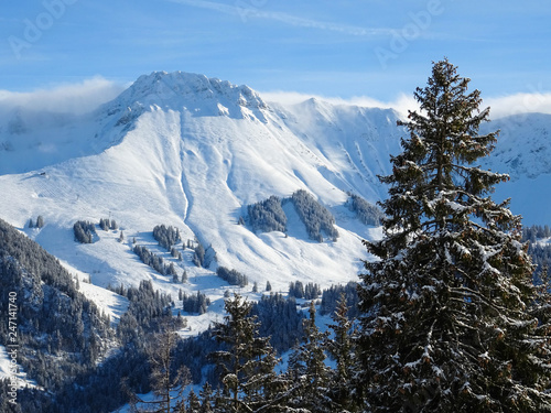 view on Kaiseregg peak covered in snow, Swiss Alps, winter hike from Schwarzsee to Fuchses Schwyberg, Fribourg (Freiburg) canton, Switzerland, Europe photo