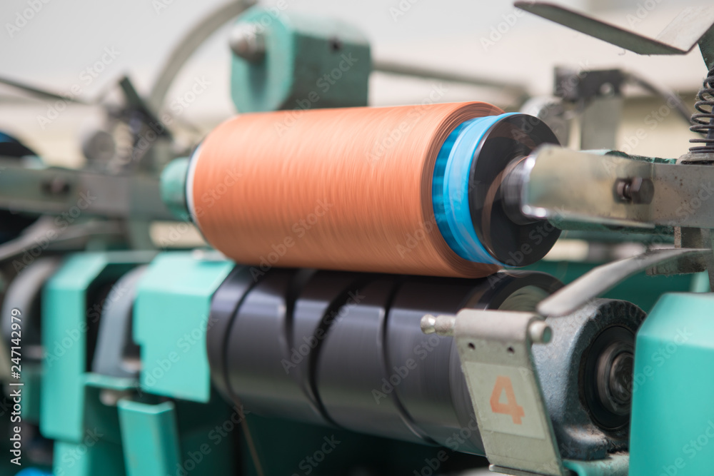 Group of bobbin thread cones on a warping machine in a textile mill. Yarn  ball making