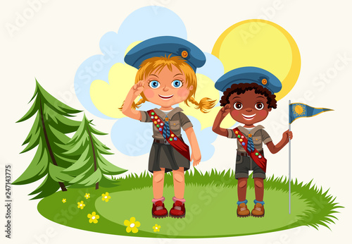 Girl and boy saluting standing on green meadow
