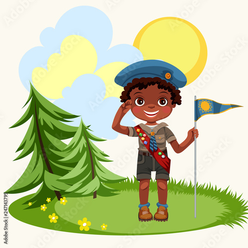 African american boy saluting standing on green meadow