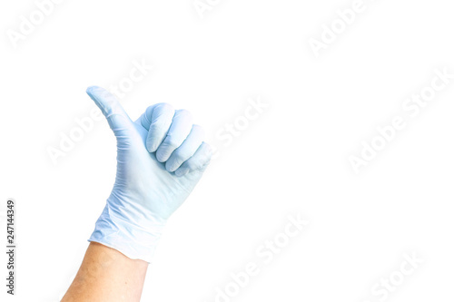 Female hands in white medical gloves showing like sign.  © Shi 