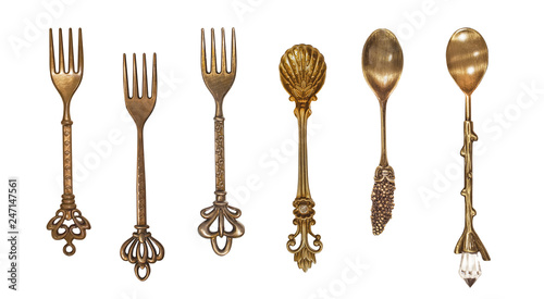 Set of vintage dessert spoons and forks on white background top view