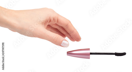 Hand with cosmetic black brush mascara, beauty product