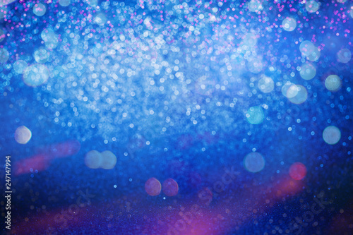 Glitter abstract background. Blue and Pink bokeh lights defocused.