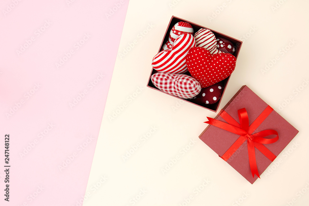 Flat lay of red pillows heart in gift box with copy space. Love and Valentine's day concept. Minimal style. Flat lay of red pillows heart in gift box with copy space. Love and Valentine's day concept. Minimal style.