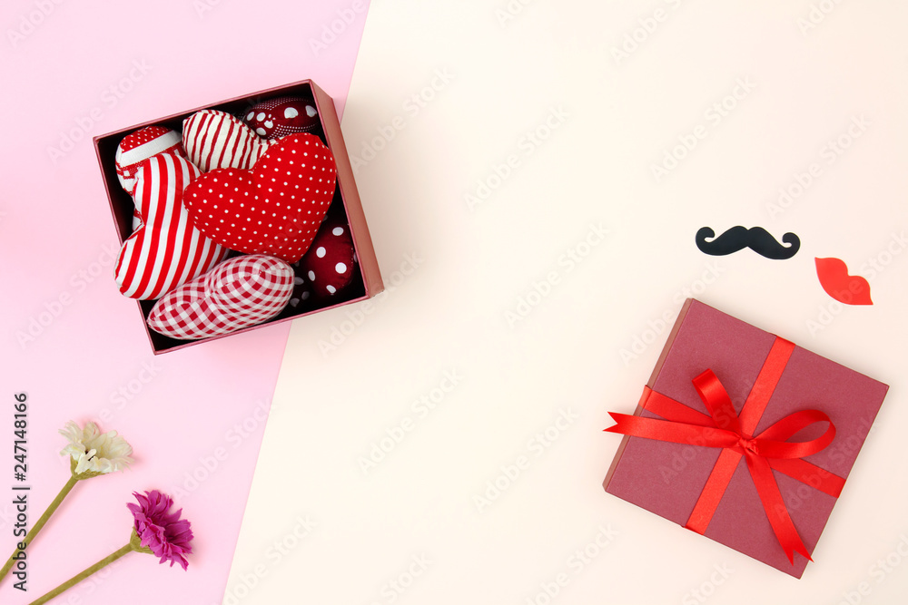 Obraz premium Flat lay of red pillows heart in gift box with copy space. Love and Valentine's day concept. Minimal style.