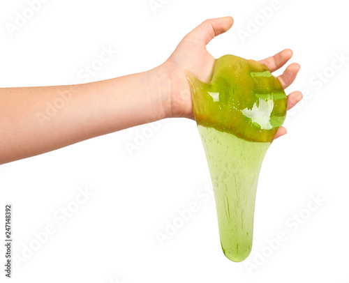 teenager playing green slime with hand  transparent toy