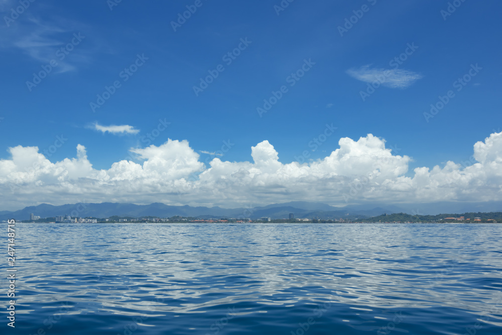 The seascape. View on the island Borneo and the city Kota Kinabalu, Malaysia. The seascape. View on the island Borneo and the city Kota Kinabalu, Malaysia.