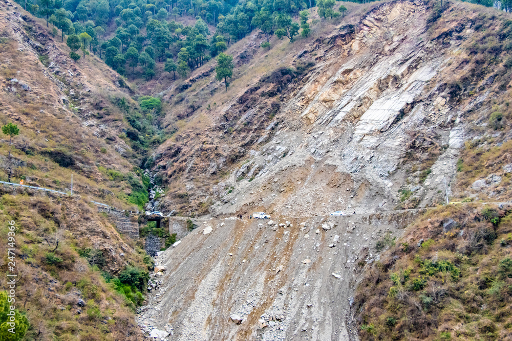 Landslides and rockfalls on the road in the mountains. Landslides and rockfalls on the road in the mountains.