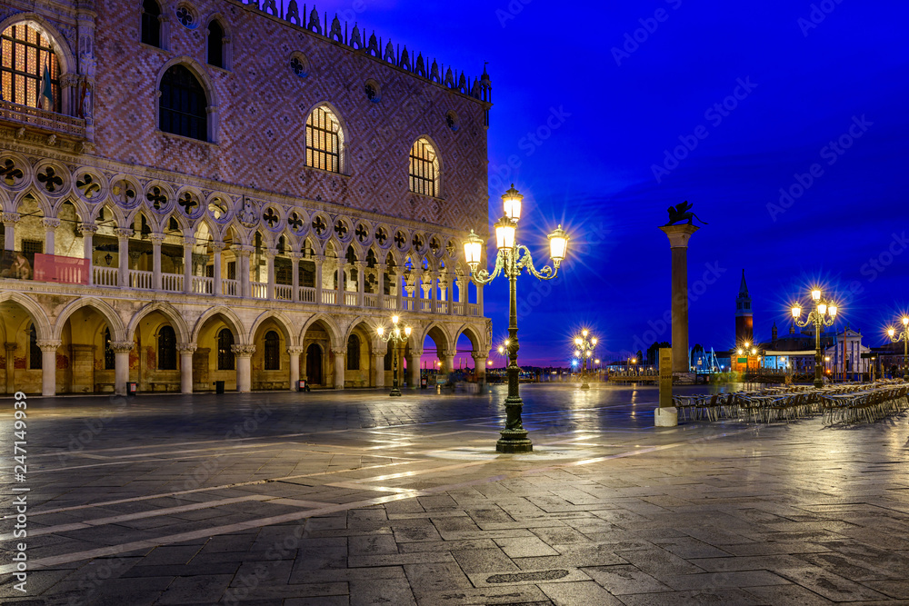 View of piazza San Marco, Doge's Palace (Palazzo Ducale) in Venice, Italy. Architecture and landmark of Venice. Night cityscape of Venice.
