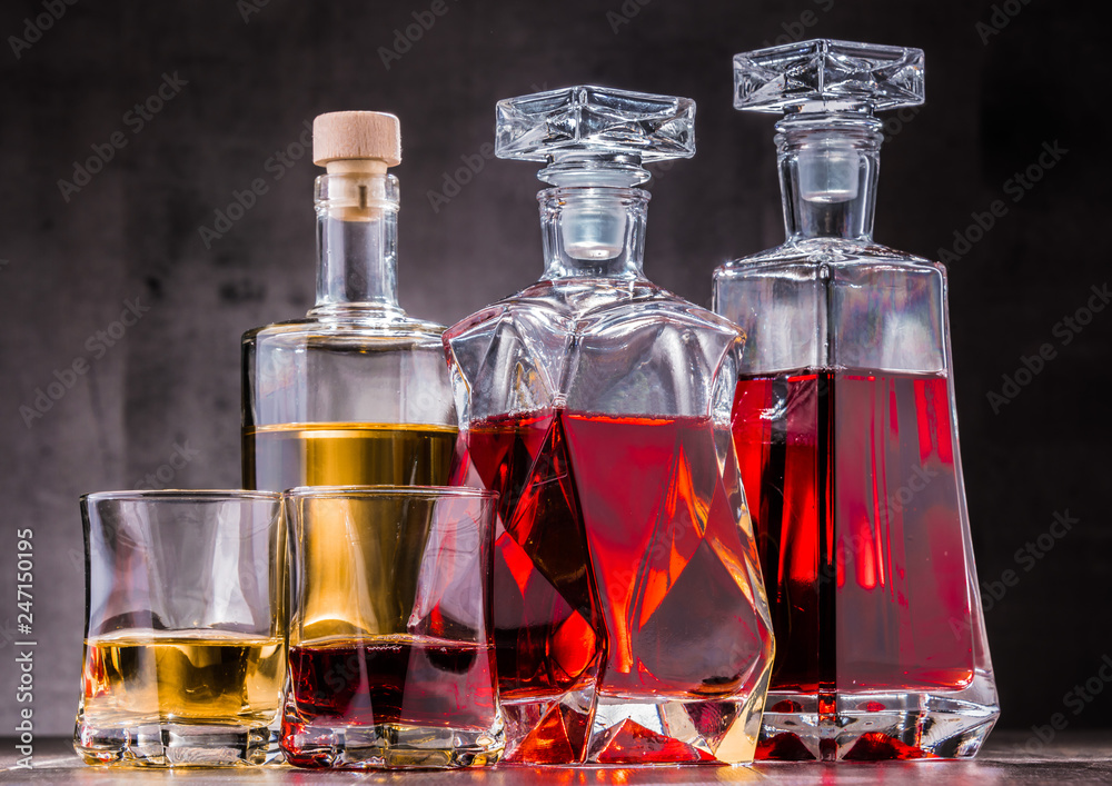 Carafe and bottles of assorted alcoholic beverages. Carafe and bottles of assorted alcoholic beverages.