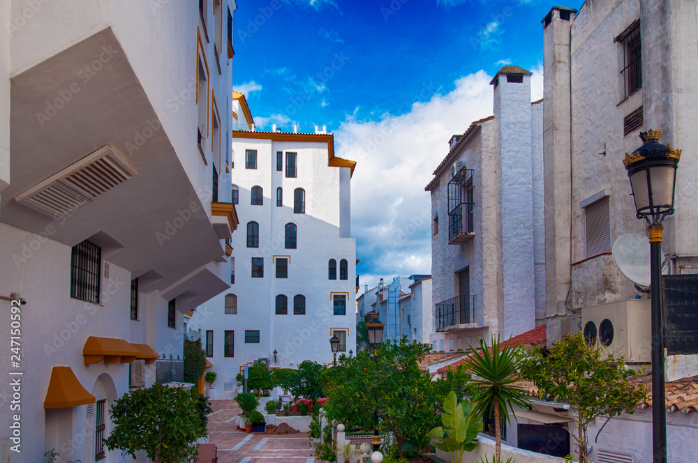 a Mediterranean city with white buildings on a blue sky a Mediterranean city with white buildings on a blue sky