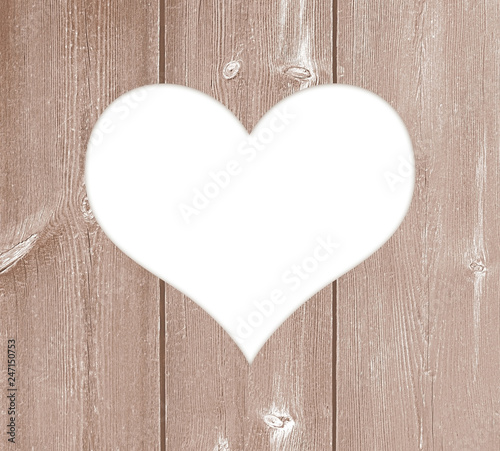 White heart with copy space for text on wood texture for Valentines greetings.