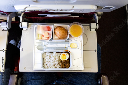 Quadro em tela Basic inflight meal consisting rice, egg, beef curry, bread, juice
