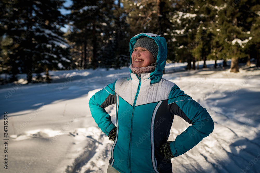 Girl in the winter forest playing snowballs Girl in the winter forest playing snowballs