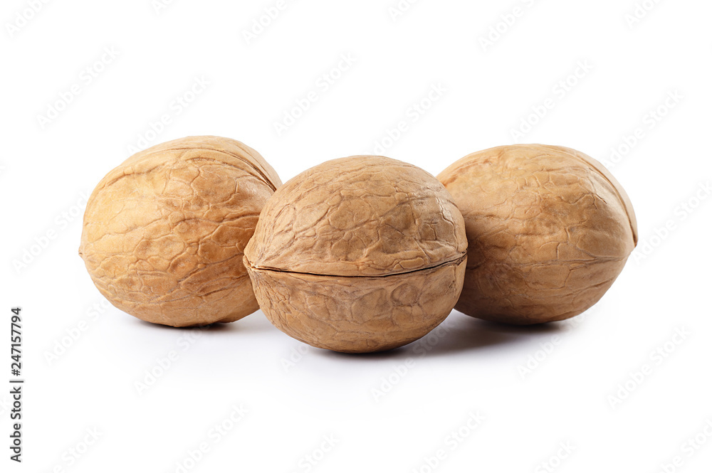 A group of walnuts isolated on white background. A group of walnuts isolated on white background.