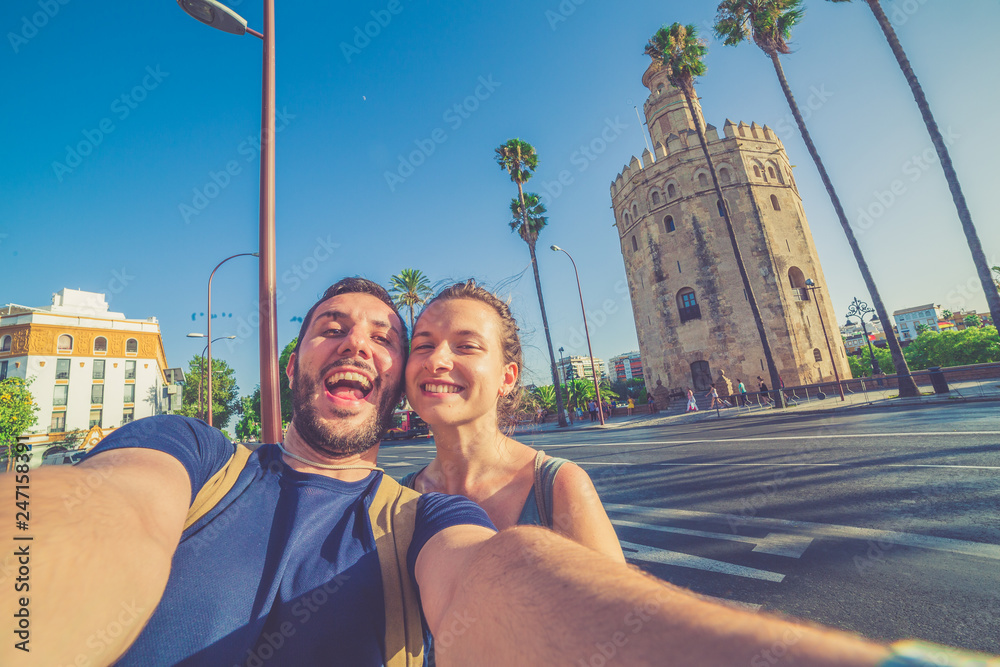 Fototapeta premium happy smiling couple take photo selfie in Spain square (plaza de espana) in Sevilla, Spain