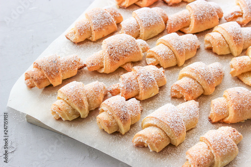Cheese bagels with powdered sugar.