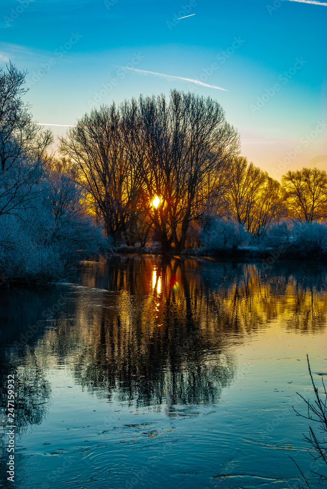 A river in the early winter morning during colorful sunrise