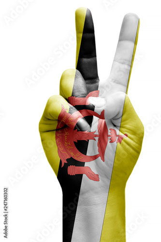 and making victory sign, Brunei painted with flag as symbol of victory, win, success - isolated on white background
